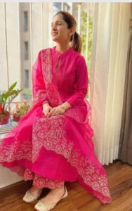 Lady wearing dark pink kurta outfit
