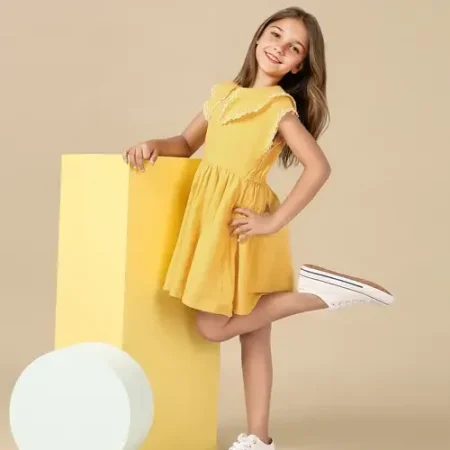 Kid in trendy yellow frock